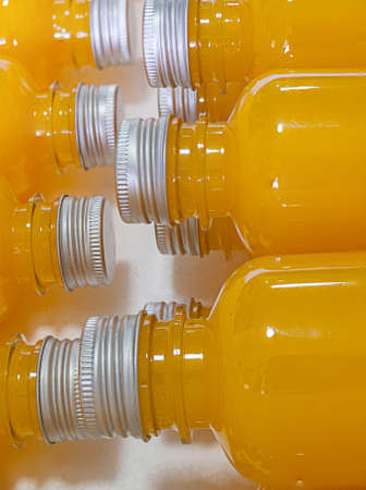 Orange juice in clear plastic bottle.の写真素材