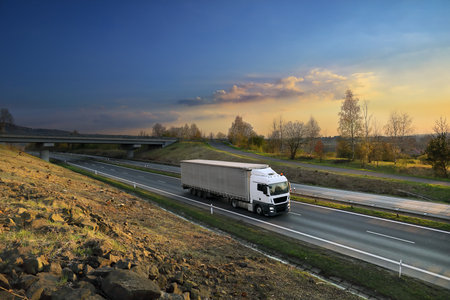 Landscape with a moving truck on the highway.の写真素材