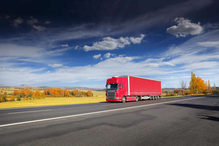 Landscape with a moving truck on the highway.の写真素材