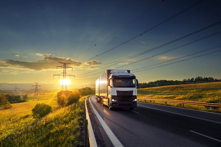 Truck on the road at sunset. Transportation, logistics, industryの写真素材