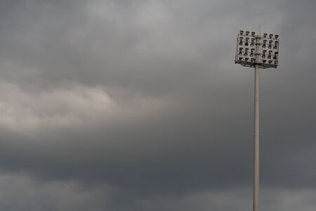 stadium light with cloudy skyの写真素材