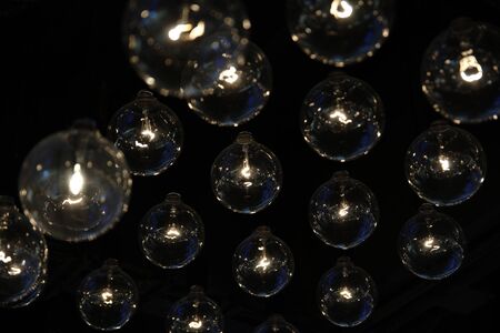 array of incandescent bulbs with blue tint