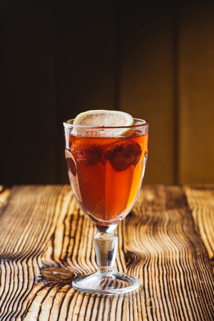 mulled wine with cinnamon, lemon and strawberryの写真素材