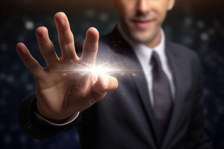 Close up of businessman hand touching screen with finger and magic light.の素材