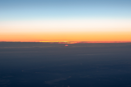 Sunset view from plane blue skyの写真素材