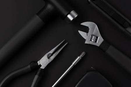 Black metal tools on black backgroundの写真素材