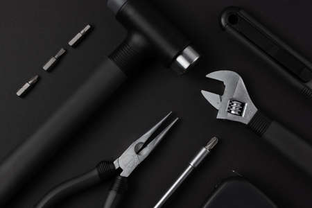 Black metal tools on black backgroundの写真素材