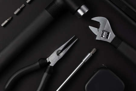 Black metal tools on black backgroundの写真素材