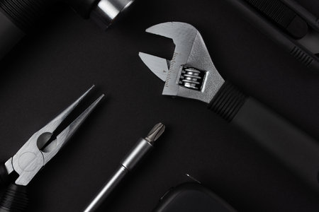 Black metal tools on black backgroundの写真素材
