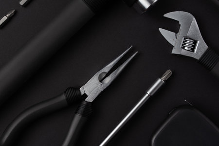 Black metal tools on black backgroundの写真素材