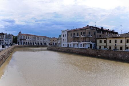 beautiful riverfront seen from a bridge in the city of senigalliaのeditorial素材