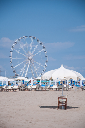 5 june 2016-rimini-italy-the beautiful Rimini beach view on a sunny day with the background the ferris wheel,italyのeditorial素材