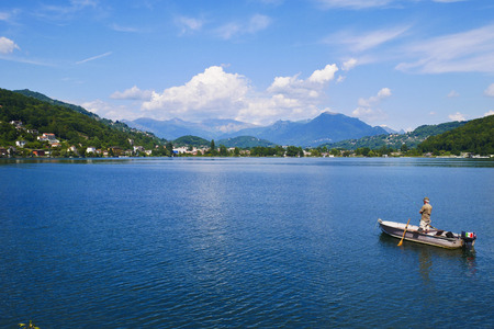 View of Lake Ceresio from the city of Lavena Ponte Tresa that borders on the homonymous Ponte Tresa in Switzerlandのeditorial素材