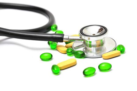 stethoscope and medicine on a white backgroundの写真素材