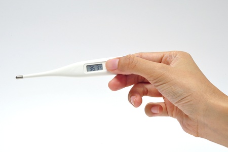 electronic thermometer in hand