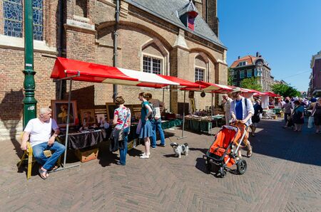 ELFT,THE NETHERLANDS - APRIL 16: People in City of Delft on April 16, 2014 , the Netherlands. Delft is known for its historic town centre with canals and a popular touristic destination.のeditorial素材