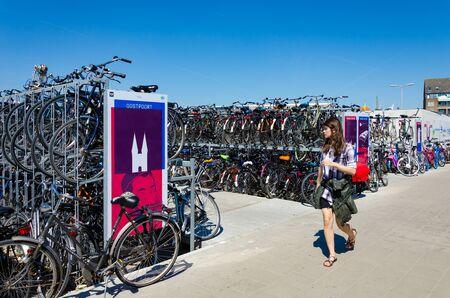 DELFT,THE NETHERLANDS - APRIL 16: Bicycles parking area near the train station at Delft on April 16,...