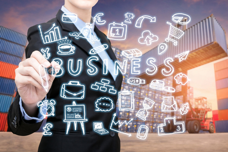 Smart Business woman is writing business concept for Global business connection with global customer for worldwide container cargo shipping.Logistic Import Export business conceptの写真素材