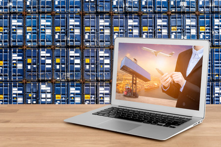 Laptop showing business shipping and internet of things technology concept for Global business connection to customer for worldwide container cargo shipping with logistic concept backgroundの写真素材