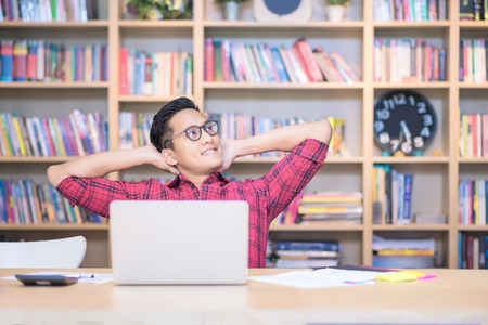 Young business freelancer working on smart computer while thinking for new ideas at Co Working Space office.Conceptual for startup small businesses entrepreneur and freelance.の写真素材