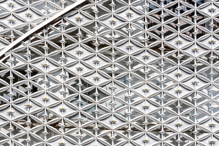 Abstract close up of modern exterior architectural metal wall pattern background.の写真素材