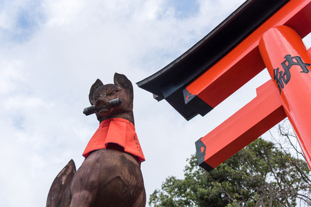 KYOTO, JAPAN-NOV 28:Stone sculpture of fox symbol statue at fushimi inari taisha shrine on November 28,2016. Fushimi inari taisha shrine is one of attraction landmarks for tourist in Kyoto, Japan.のeditorial素材
