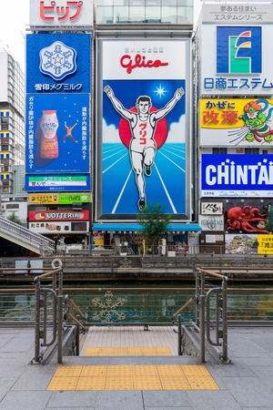 OSAKA,JAPAN-NOV 29: Dotonbori street entertainment area by its eccentric atmosphere and large illuminated signboards on November 29,2016. Dotonbori is one of the principal tourist destination.のeditorial素材