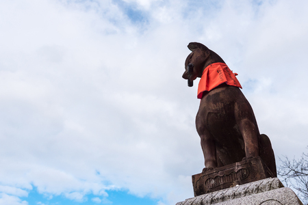 KYOTO, JAPAN-NOV 28:Stone sculpture of fox symbol statue at fushimi inari taisha shrine on November 28,2016. Fushimi inari taisha shrine is one of attraction landmarks for tourist in Kyoto, Japan.のeditorial素材