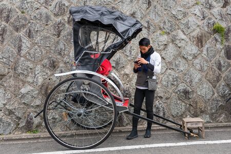 KYOTO, JAPAN-NOV 26 : Rickshaw driver waiting for tourist in Kyoto on November 26, 2106. Kyoto is a...