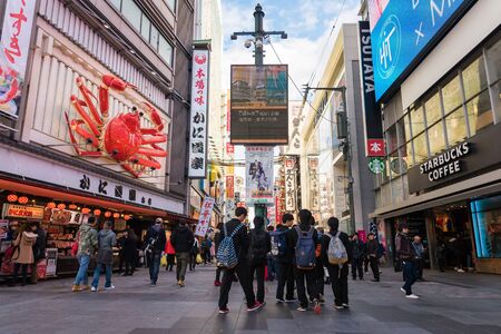OSAKA,JAPAN-NOV 29: Dotonbori street entertainment area by its eccentric atmosphere and large illuminated signboards on November 29,2016. Dotonbori is one of the principal tourist destination.のeditorial素材