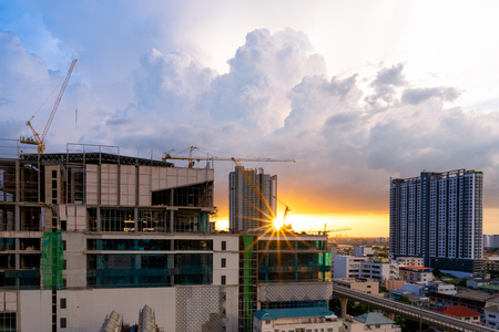 Construction site busy operate in beginning of building new complex infrastructure project at twilight time.の写真素材