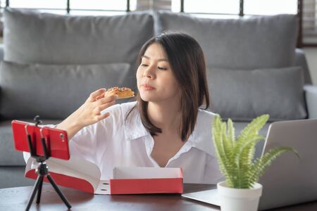 Asian business working women work from home during corona virus or covid19 crisis follow the Social Distancing regulation.の写真素材