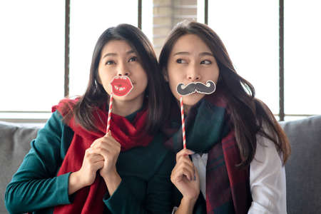 Two Females enjoy to celebrate Christmas and new year party at home in Decemberの写真素材