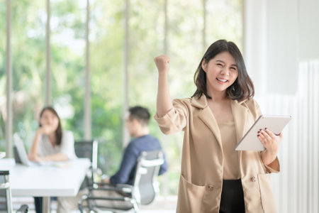 Business employee enjoy and happy to work at company office with positive attitude.の写真素材