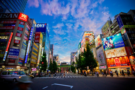 Tokyo, Japan - Oct 9, 2012  Akihabra district of Tokyo by night also known as  electric town , this area is famous for its maid cafes, electronics shops and otaku goods  Light trails can be seen from passing traffic のeditorial素材