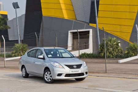 Nissan Sunny 2013 Model on the roadのeditorial素材