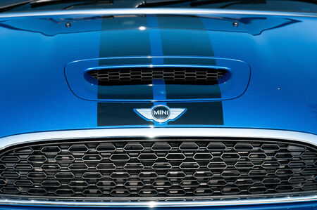 Mini brand logo on engine cover, with blue colour body.