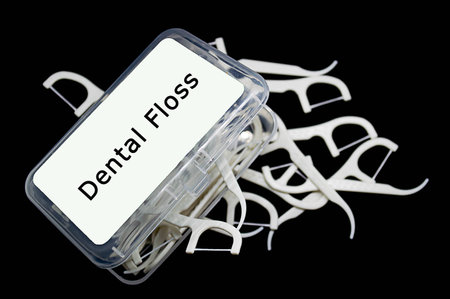 toothpick and dental floss on a black backgroundの写真素材