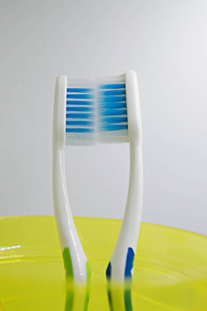 toothbrush in glass on white background.の写真素材