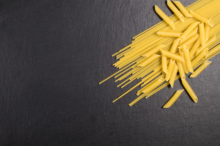 Pasta isolated over a slate stoneの写真素材