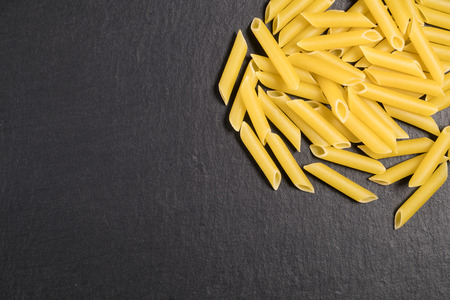 Pasta isolated over a slate stoneの写真素材