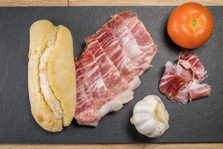 Iberian ham sandwich © rico de bellota with tomato and garlic headの写真素材