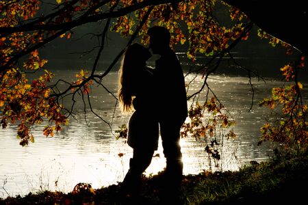 lovers on the shore of the lake, invisible figuresの写真素材
