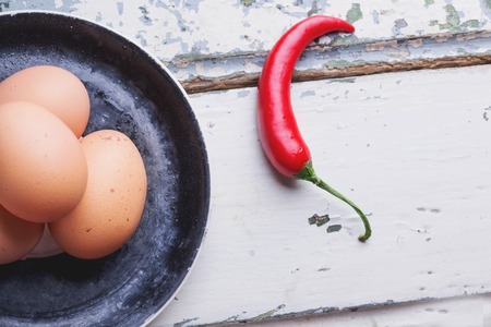 Quinoa Burger ingredients:  quinoa, mangold, dry grain mix, chili pepper, eggs green peas basil on white rustic boardの写真素材