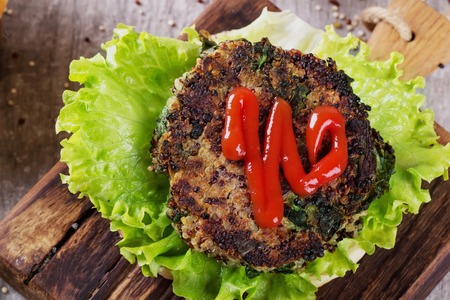 Veggie quinoa burgers with  lettuce, tomato and spinachの写真素材