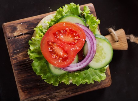 Veggie quinoa burgers with  lettuce, tomato and spinachの写真素材