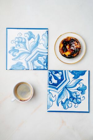 Pastel de nata. Traditional Portuguese dessert, egg tart on the ceramic plate with Traditional...