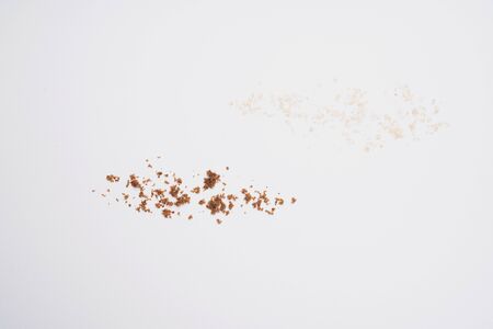 Granulated brown sugar  and muscovado sugar isolated on a white background. Abstract pattern. Top viewの写真素材