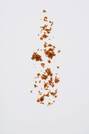 Muscovado sugar isolated on a white background. Abstract pattern. Top viewの写真素材