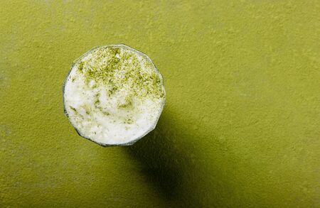 Matcha tea backgrounds: Matcha latte with milk foam. top view. copy spaceの写真素材